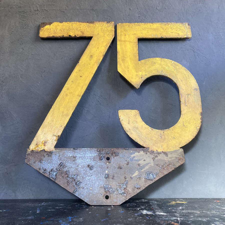 Metal '75' speed sign.