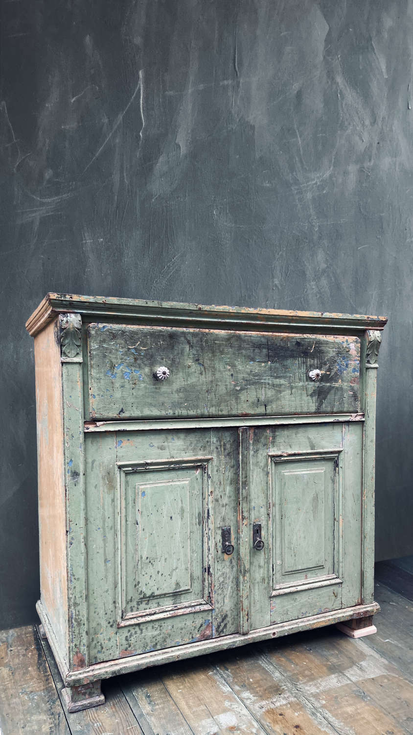 Green Continental cabinet with large drawer.