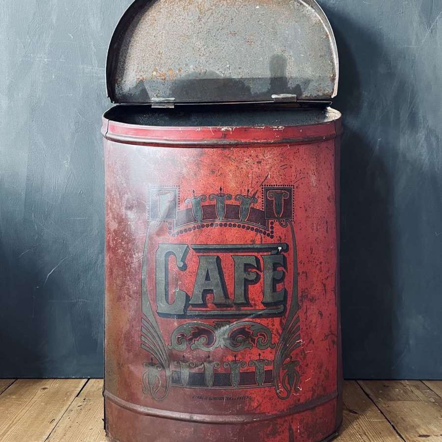 Large metal coffee storage container.